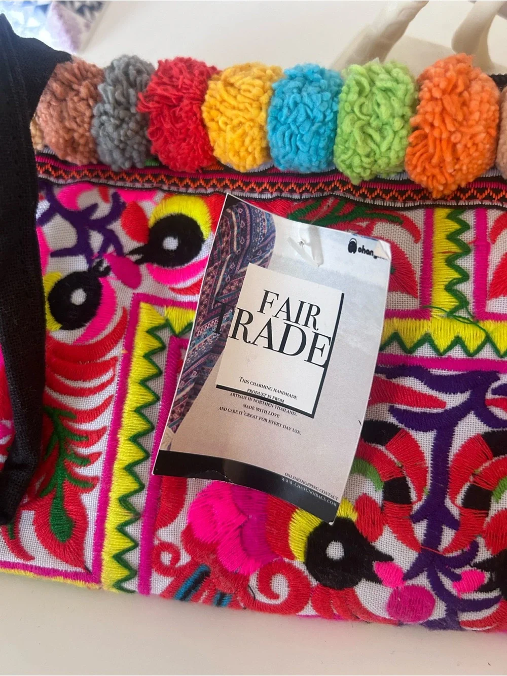 Colorful Embroidered wristlet with Pom Poms